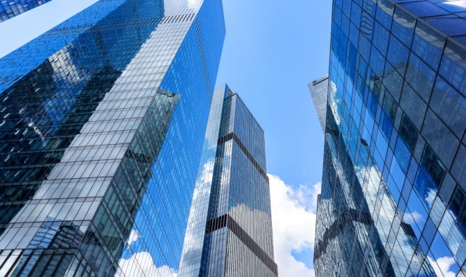 View Of Modern Glass Skyscrapers In Financial District. Contemporary Corporate Architecture Symbolizing Business, Finance And Urban Development.